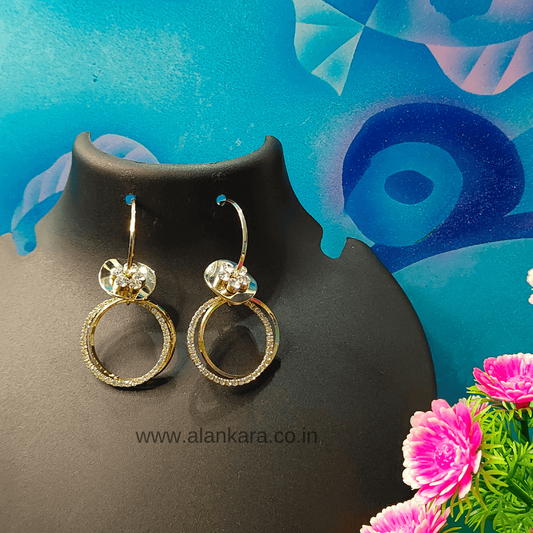 Golden floral hoop earrings