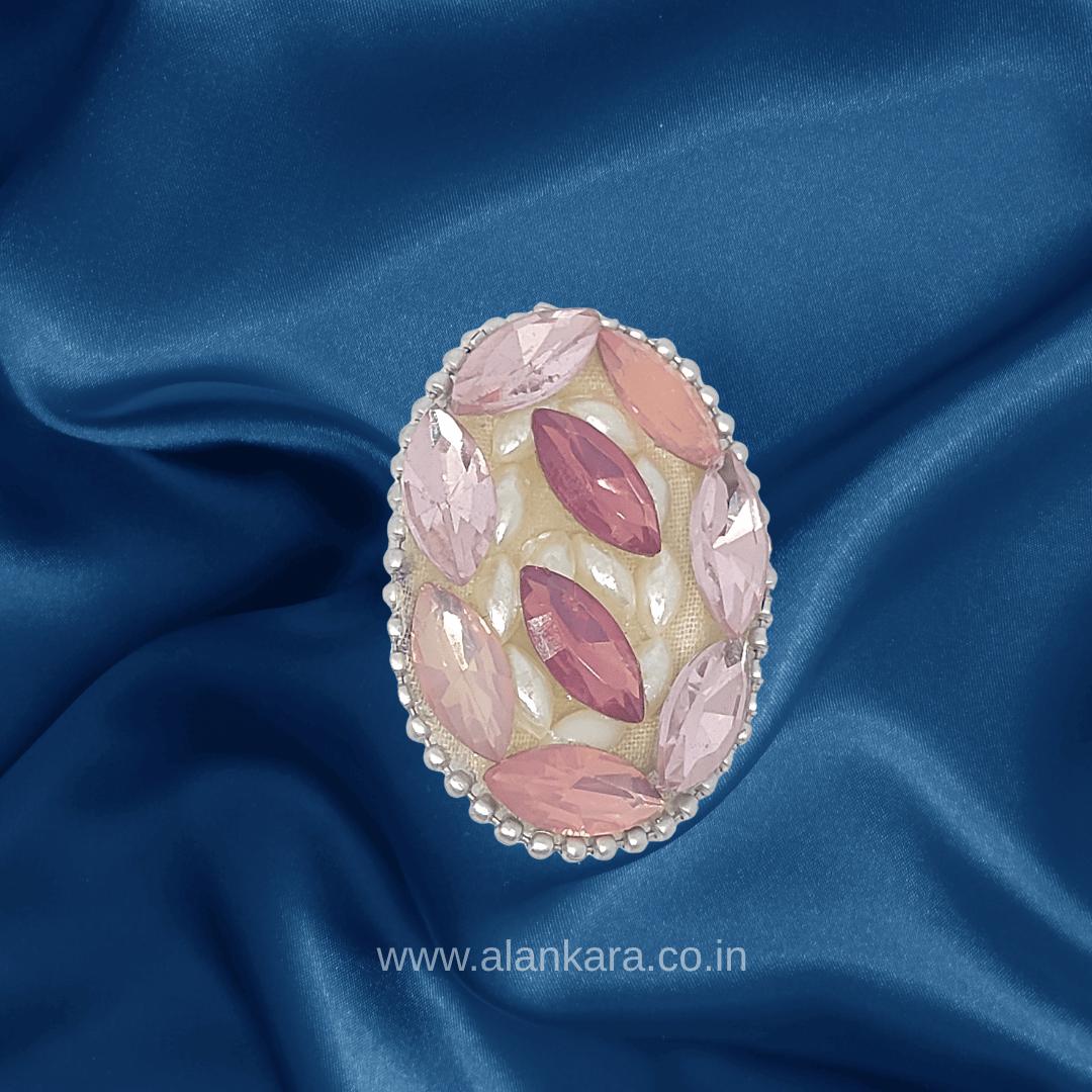 Blush Pink Crystal Pearl Saree Pin with sparkling crystals and pearls on a blue satin fabric backdrop.