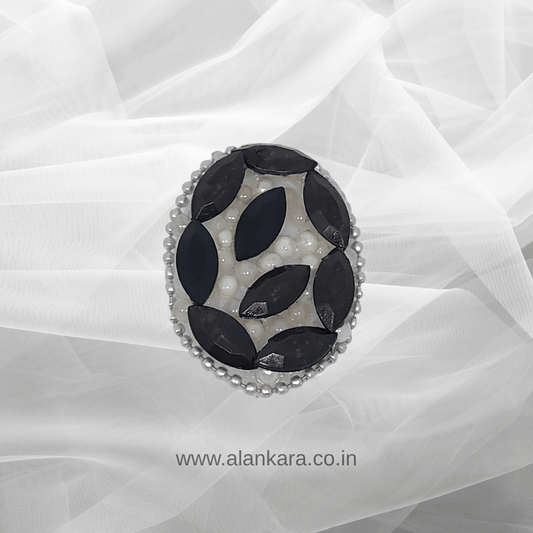 Black Crystal Pearl Saree Pin showcasing black crystals and pearls on a delicate background.