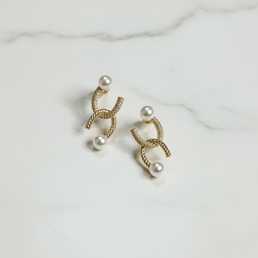 Golden curve pearl studs - Stainless steel earrings