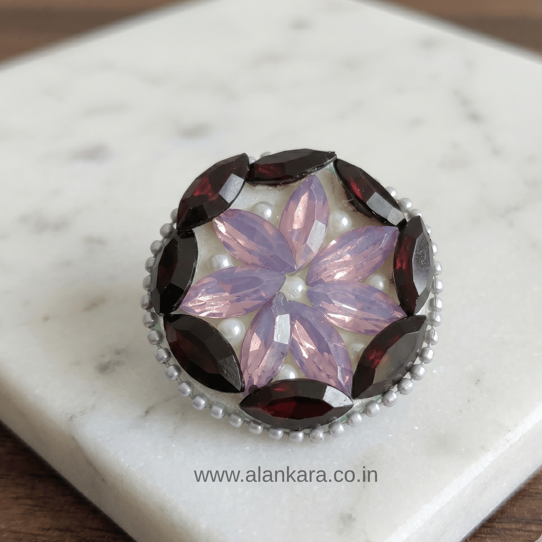 Black & Lavender Crystal Pearl Saree Pin featuring sparkling crystals and pearls in a floral pattern.
