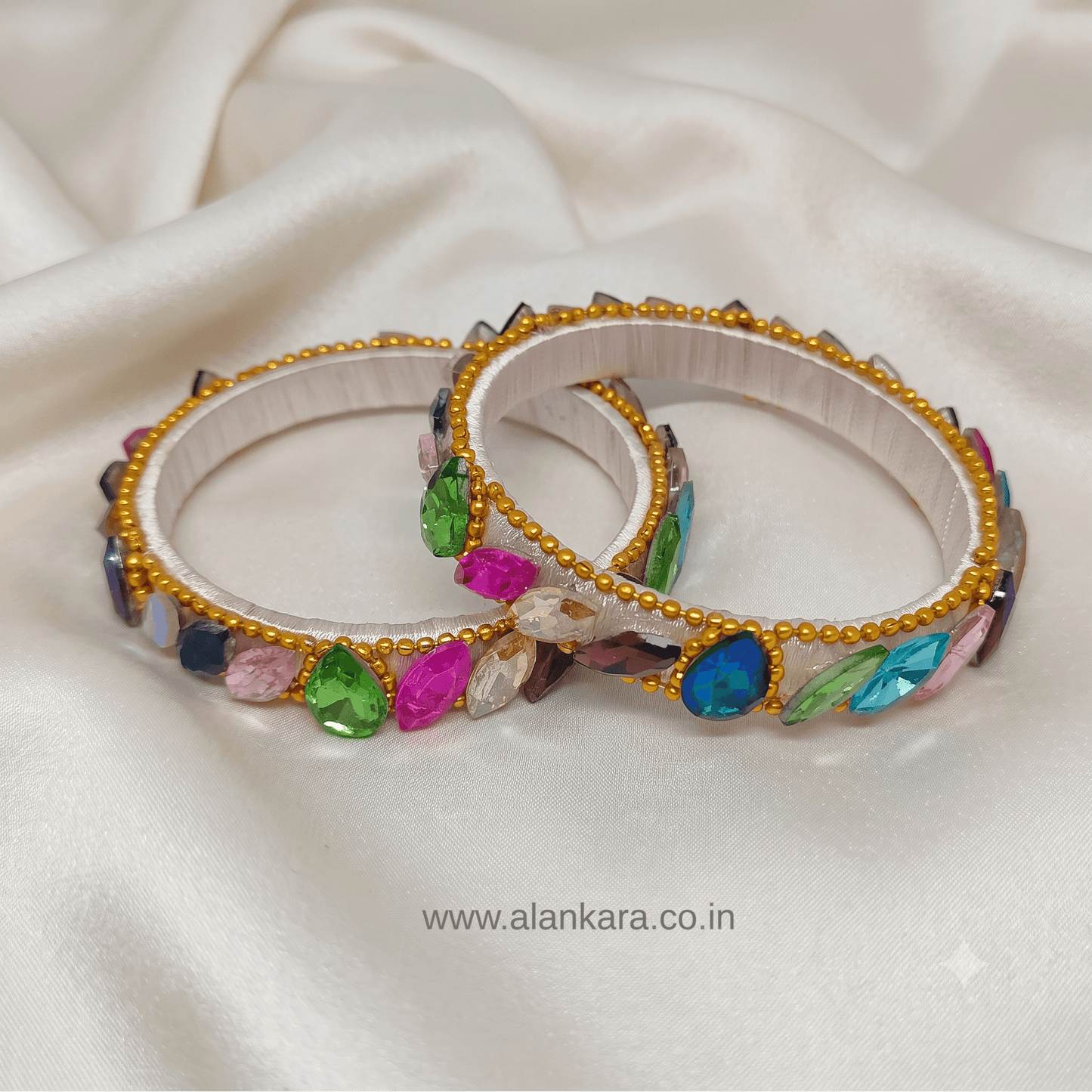 Multicolor White Silk Thread Kada Bangles featuring colorful crystals and golden bead detailing.