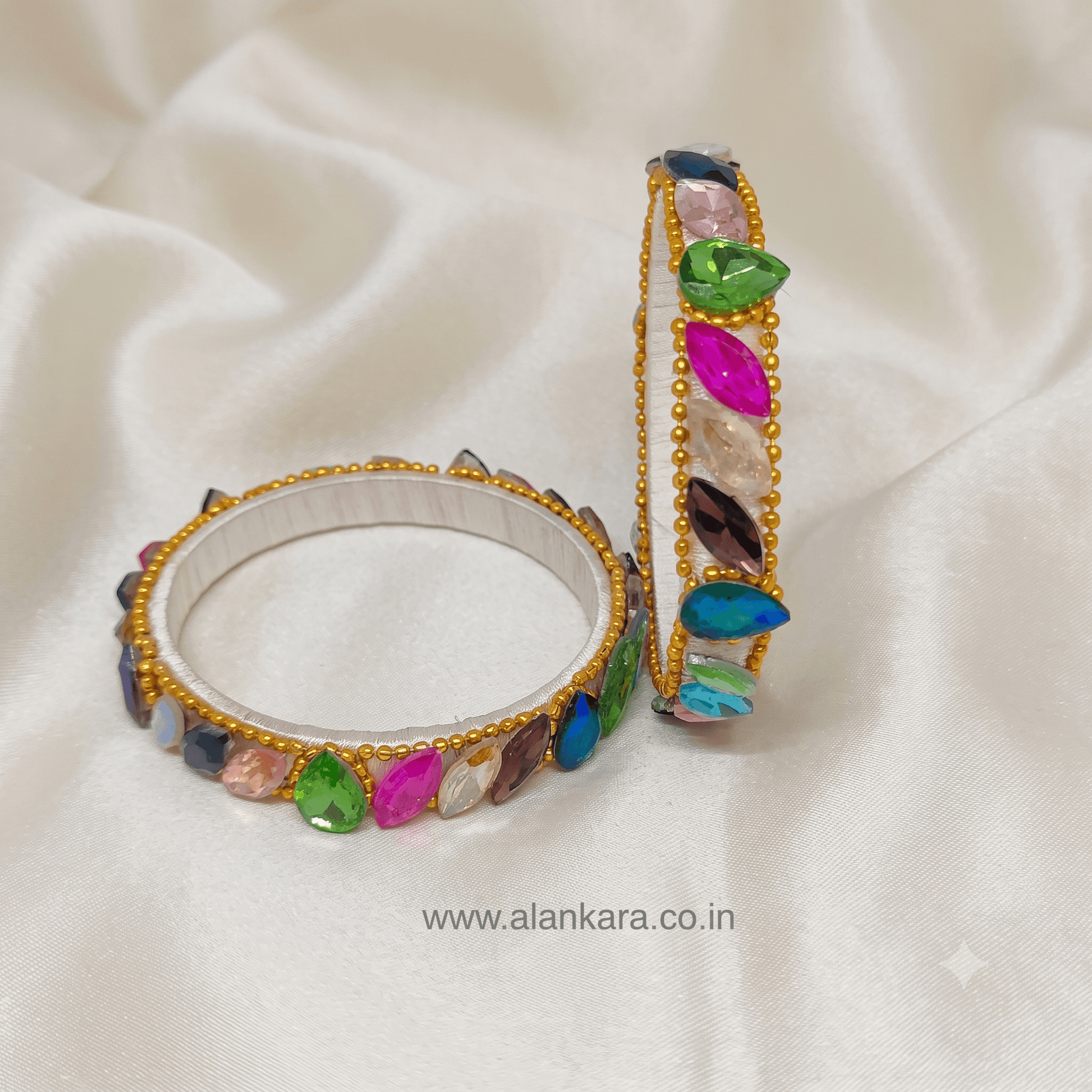 Multicolor White Silk Thread Kada Bangles featuring vibrant crystals and golden bead detailing.