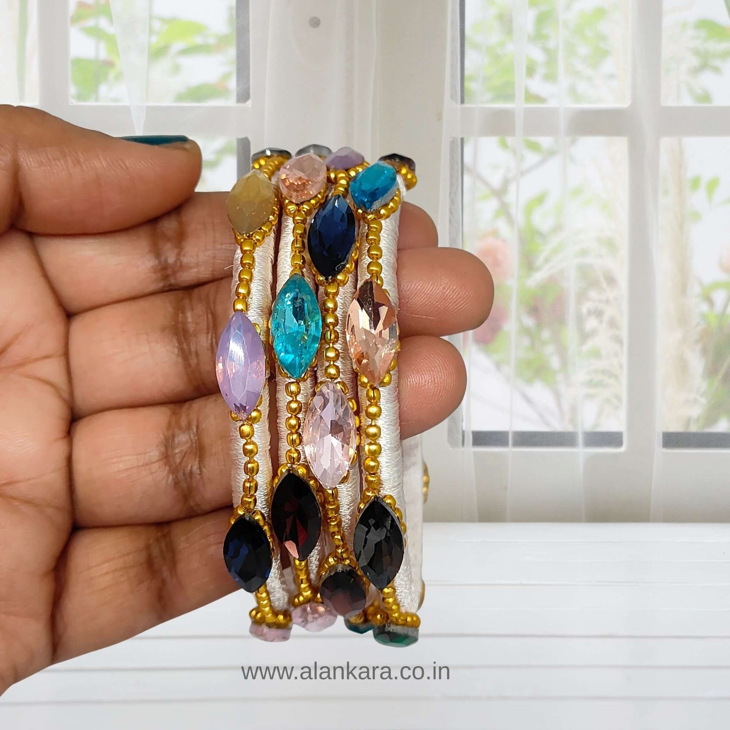 Multicolor White Silk Thread Bangles featuring colorful crystal stones and golden bead detailing