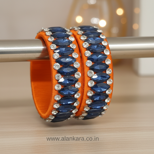 Orange Blue Crystal Silk Thread Kada Bangles featuring deep blue crystals and sparkling zircon stones on orange silk.
