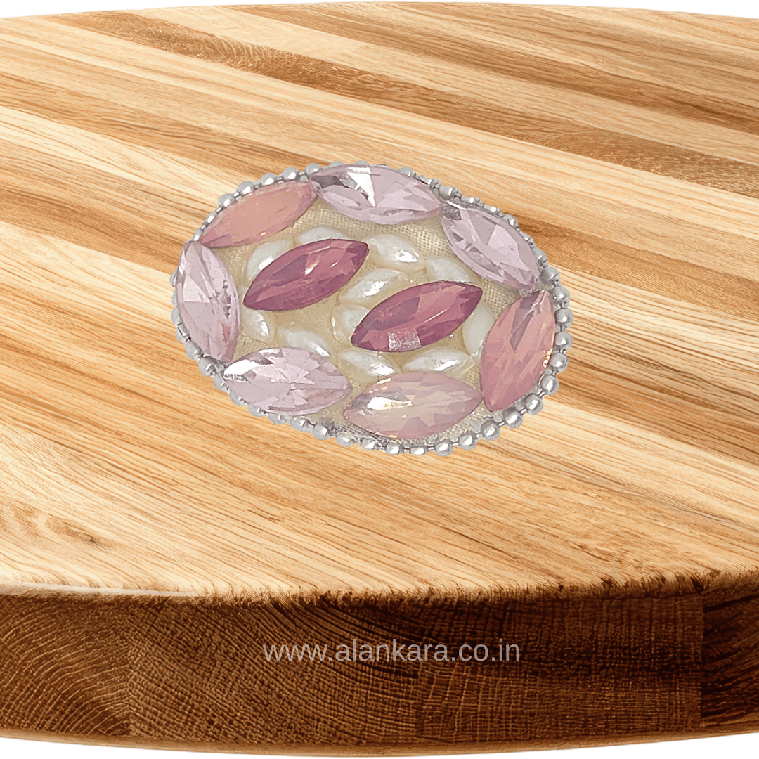 Blush Pink Crystal Pearl Saree Pin featuring sparkling crystals and pearls on a wooden background.
