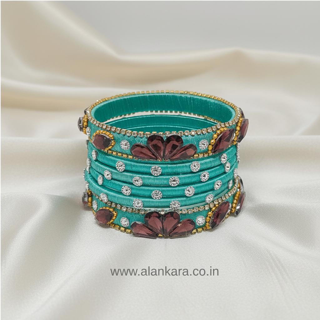 Pista Green Crystal Noori Silk Thread Bangles showcasing vibrant colors and intricate embellishments on a luxurious background.