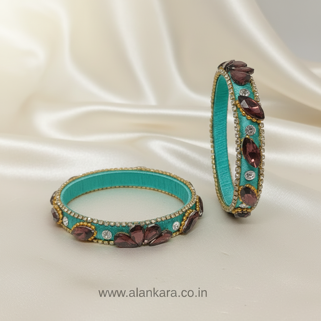 Pista Green Crystal Silk Thread Kada Bangles adorned with wine-colored crystals and golden detailing.