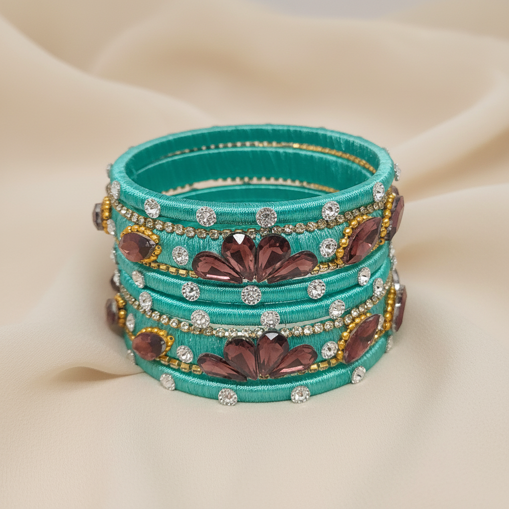 Pista Green Crystal Noori Silk Thread Bangles showcasing exquisite embellishments and festive colors on a soft background.