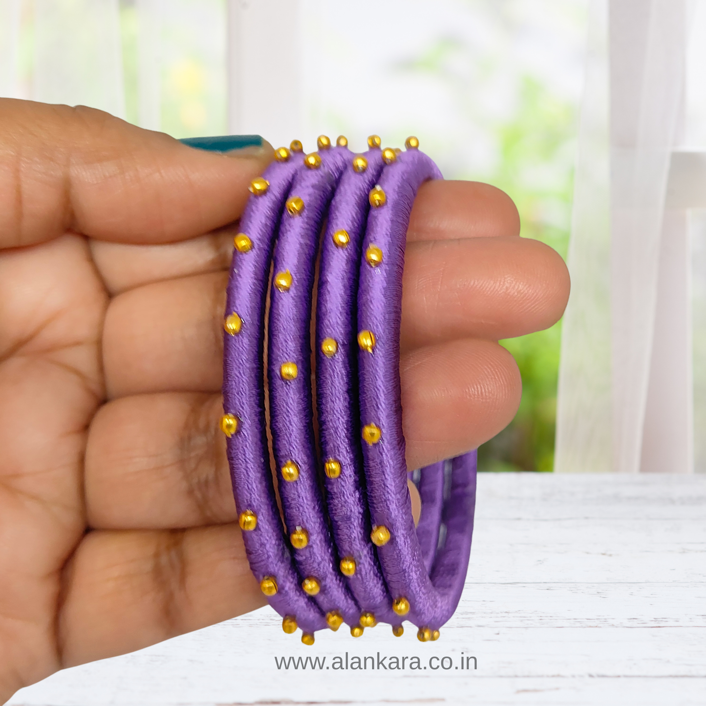 Royal Purple Golden Silk Thread Bangles with golden beads, perfect for festive and everyday elegance.
