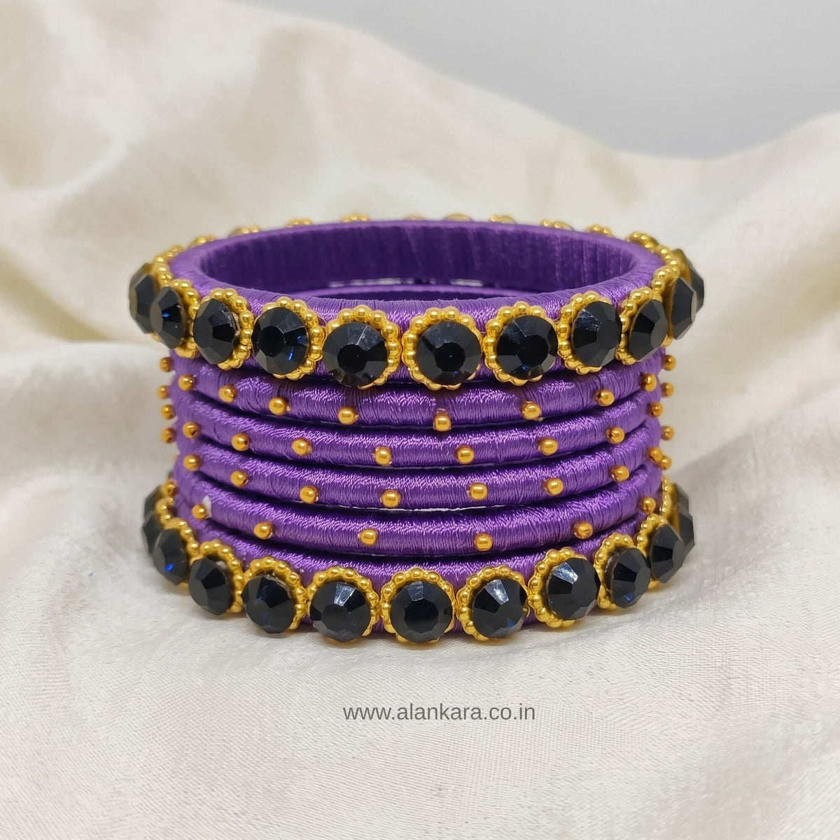 Royal Purple crystal Silk thread bangles with navy-blue crystal accents and golden beads, elegantly handcrafted.