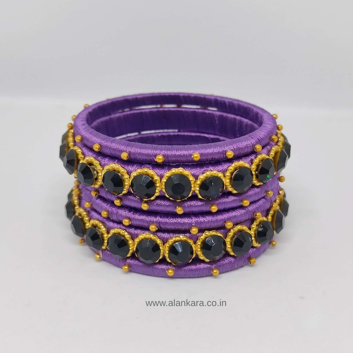 Royal Purple crystal Silk thread bangles featuring purple silk, dark blue crystal accents, and golden beads.