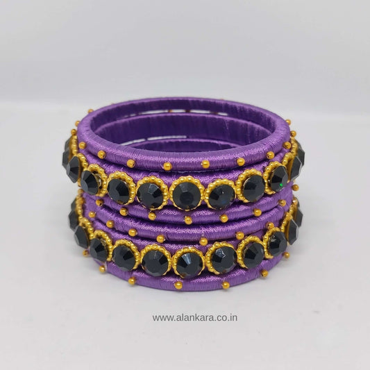 Royal Purple crystal Silk thread bangles featuring purple silk, dark blue crystal accents, and golden beads.