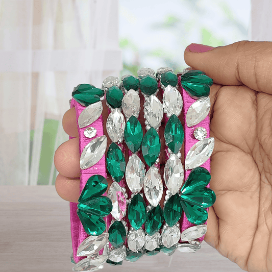 Rani Pink Emerald White Crystals Silk Thread Bangles elegantly crafted with green and white crystals on silk thread.
