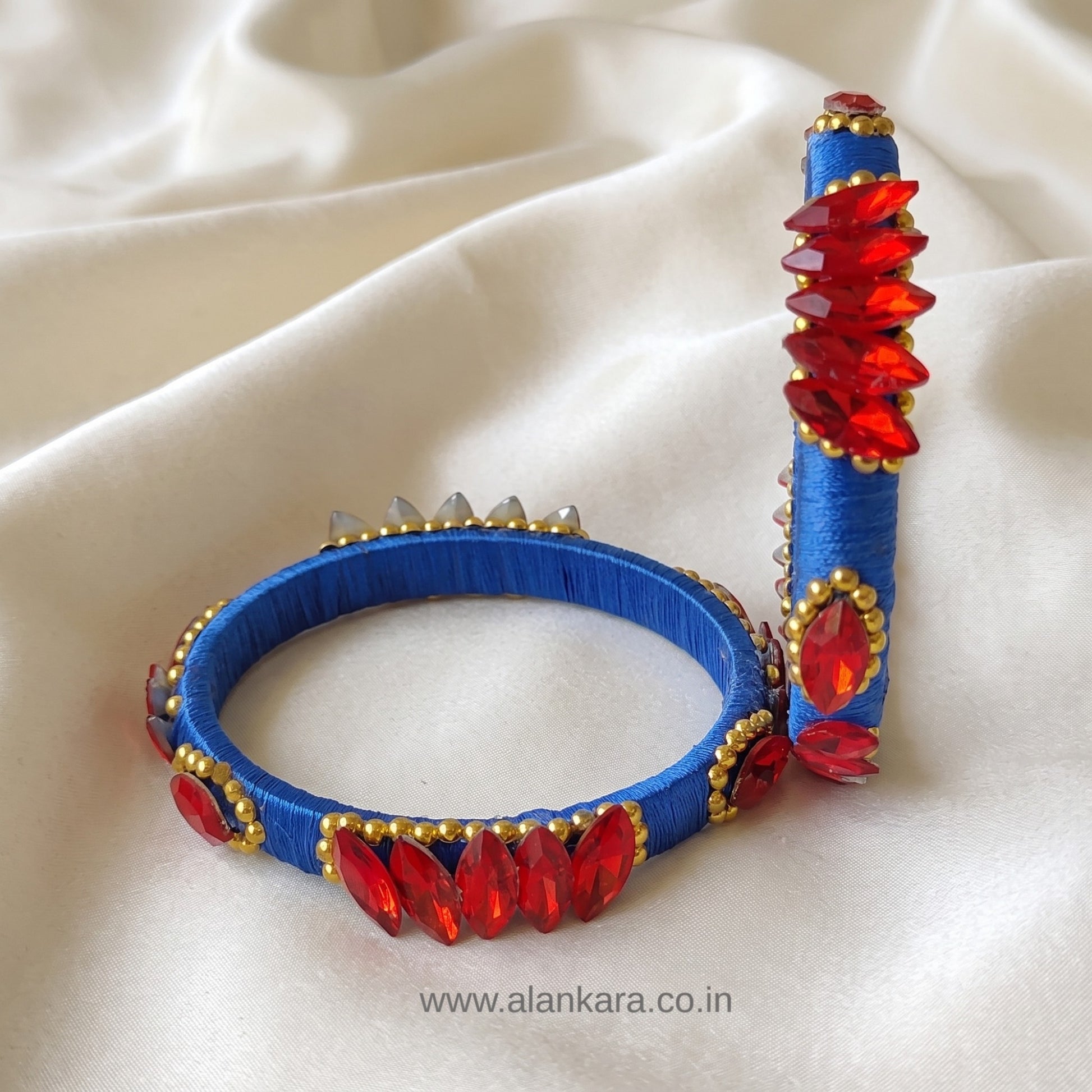 Royal Blue Red Crystal Silk Thread Kada Bangles showcasing royal blue silk thread and red crystals with golden bead detailing.