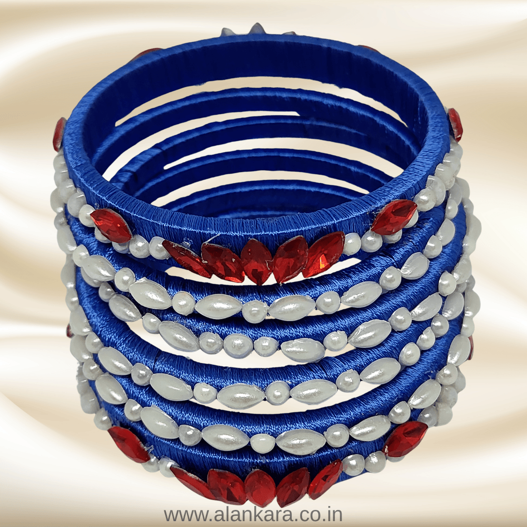 Royal blue Pearl Crystal silk thread bangles with white pearls and red crystals in elegant floral design.
