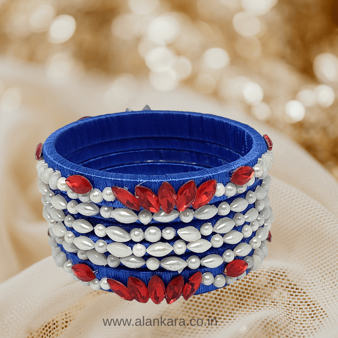 Royal blue Pearl Crystal silk thread bangles featuring white pearls and red crystals in a floral design.