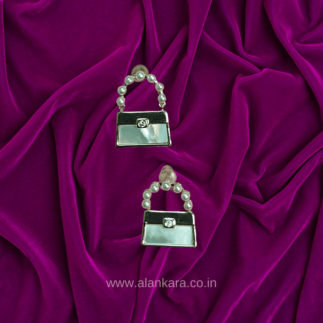 White earrings western purse studs | Alankara