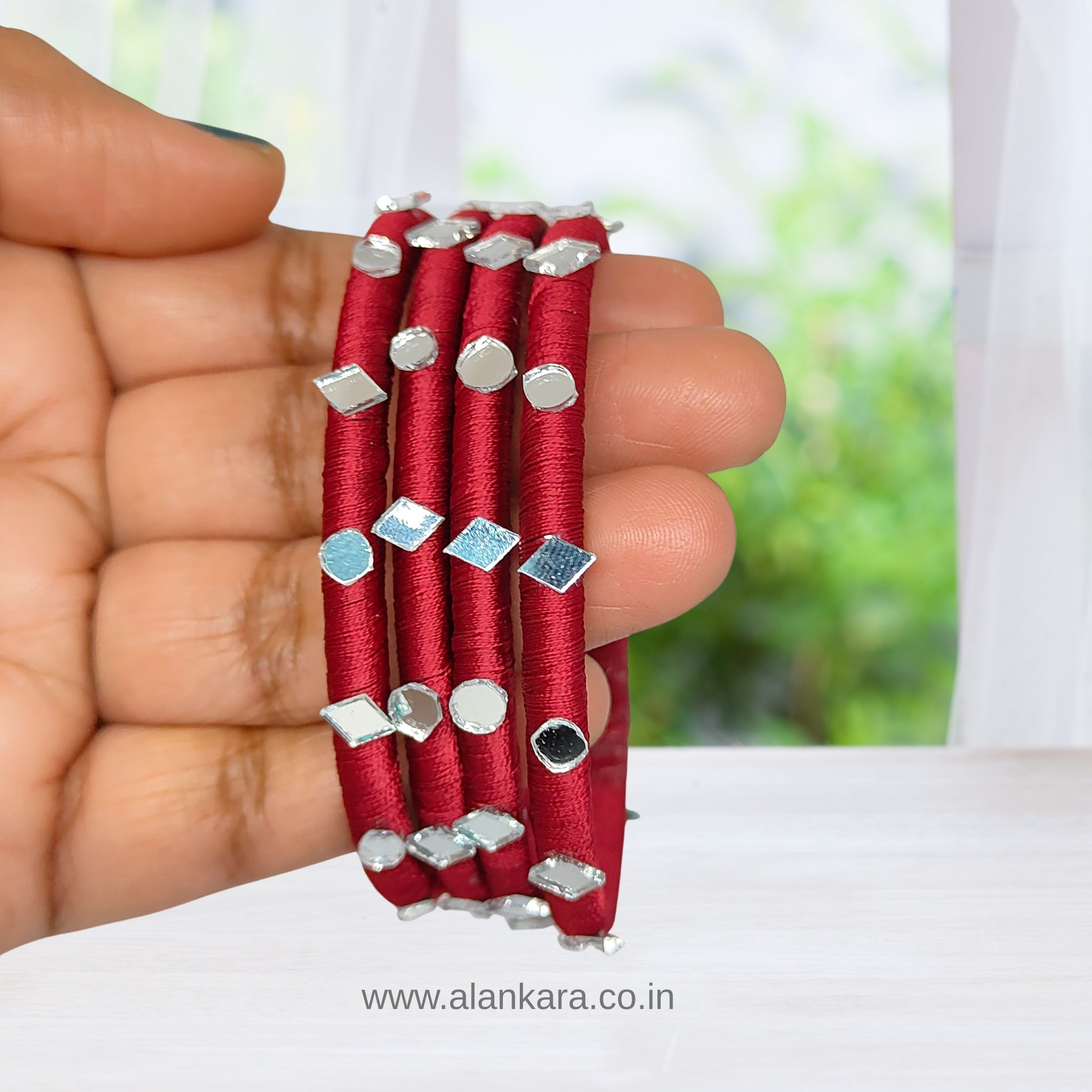 Handcrafted White Maroon Silk Thread Bangles with silver-white mirror embellishments.