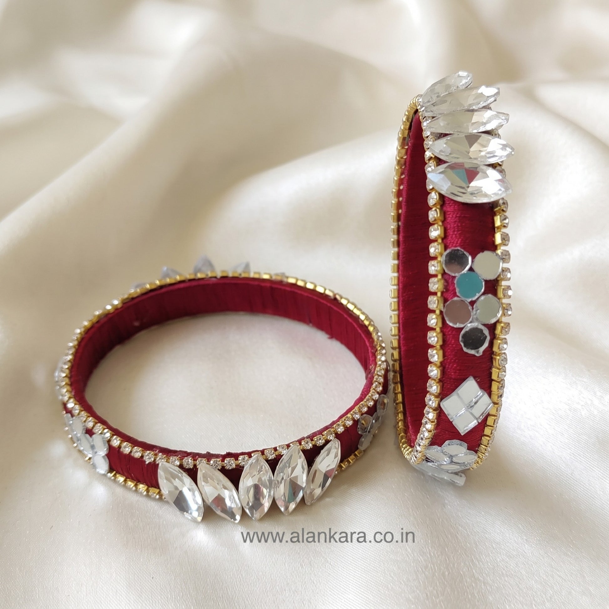 White Crystal Wine Silk Thread Kada Bangles adorned with sparkling crystals and mirror accents.
