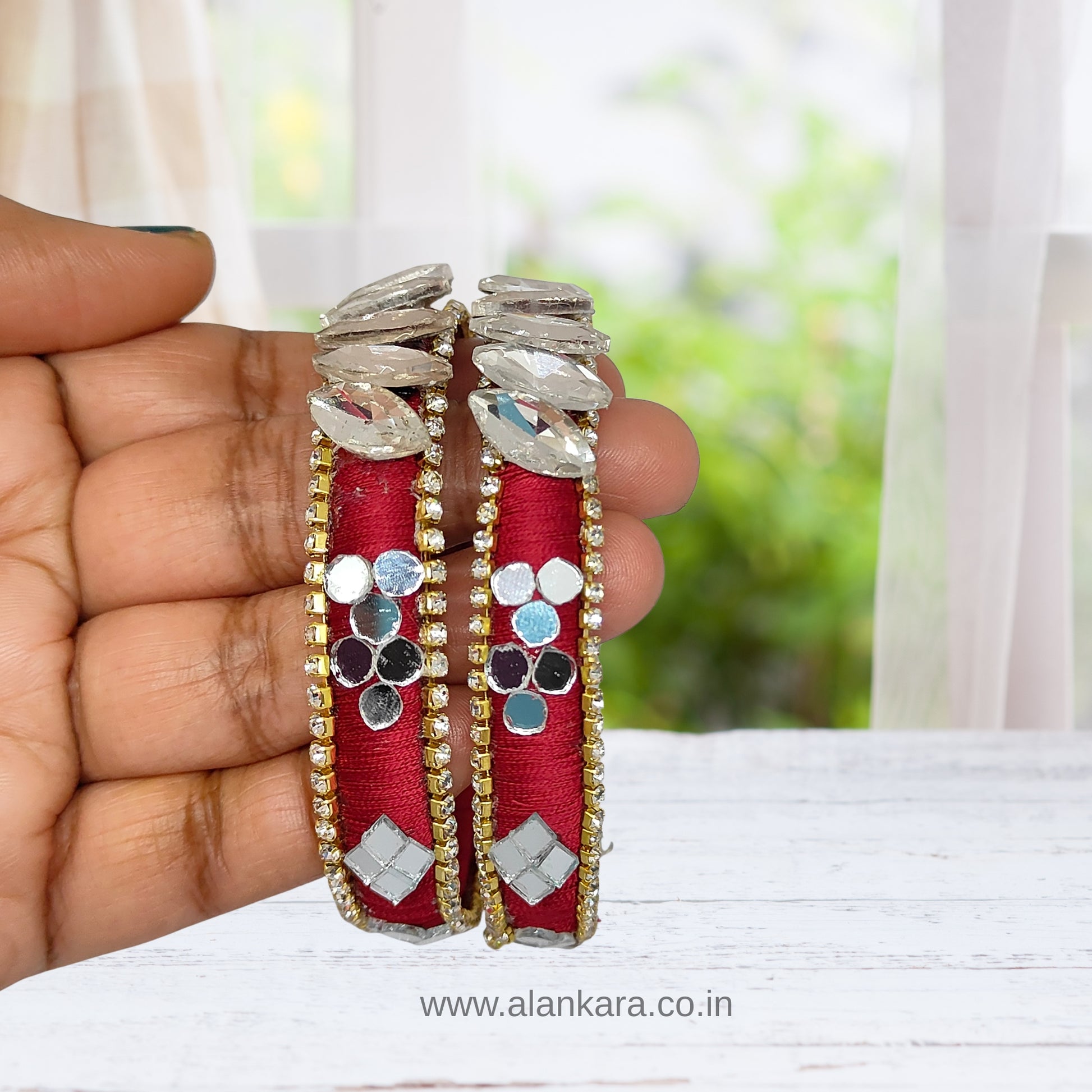 White Crystal Wine Silk Thread Kada Bangles showcasing bright red silk with sparkling embellishments and mirror accents.