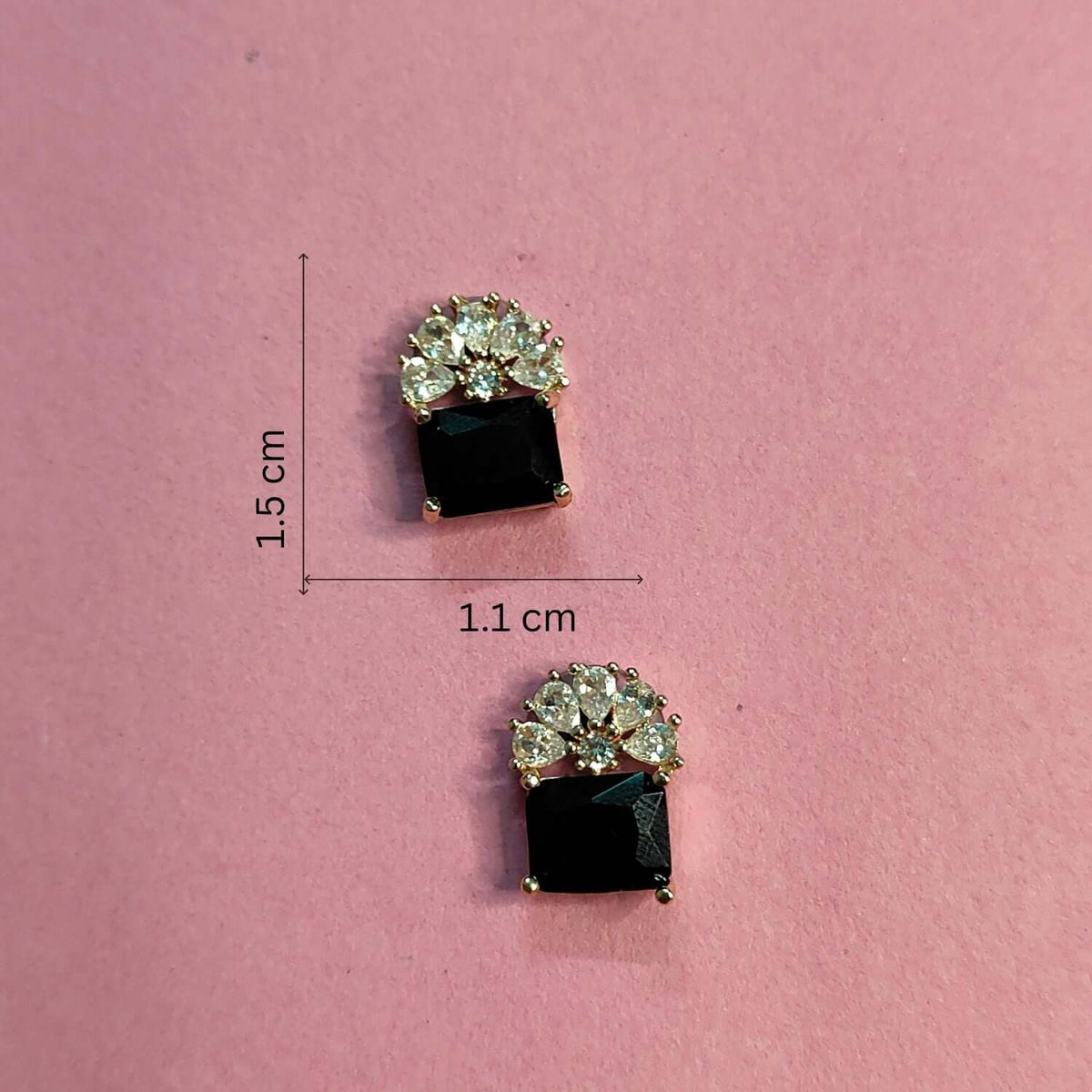 Black floral Crystal Stud earrings on pink background, dimensions 1.5 cm by 1.1 cm, featuring alloy and cubic zirconia.