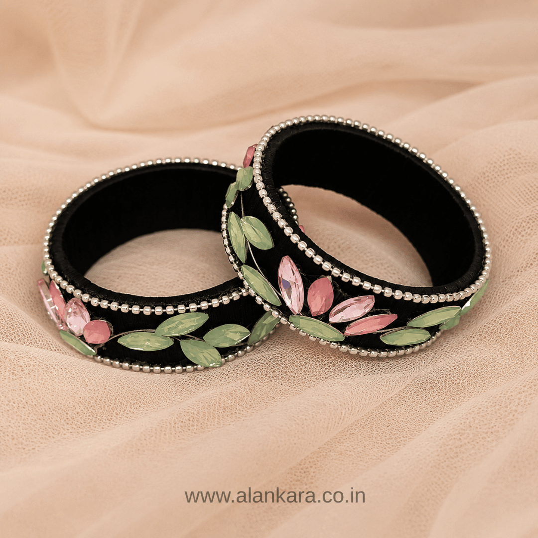 Black Pastel Crystal Silk Thread Kada Bangles on a soft backdrop showcasing floral patterns and vibrant crystals.