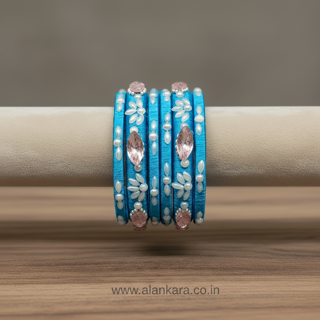 Blue Pearl Crystal Silk Thread Bangles beautifully crafted with blue silk and adorned with shimmering pearls and crystals.