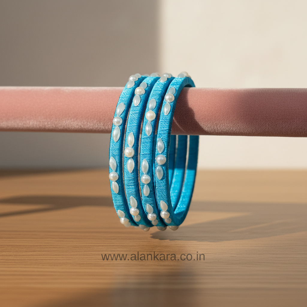 Blue Pearl Silk Thread Bangles showcasing vibrant sky-blue silk with delicate pearl detailing.