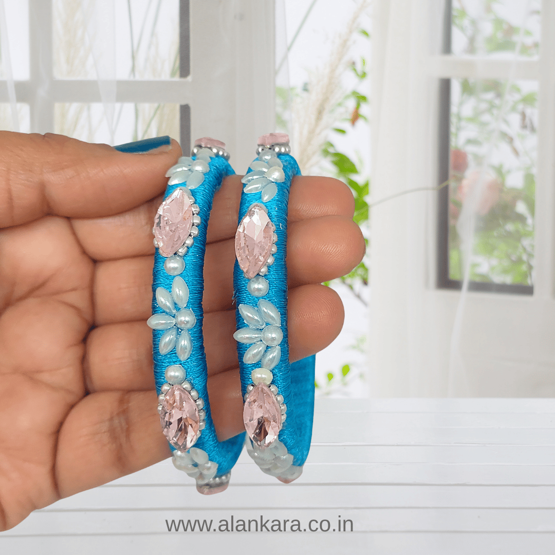 Blue Pearl Crystal Silk Thread Kada Bangles with blue silk thread, white pearls, pink crystals, and floral detailing.