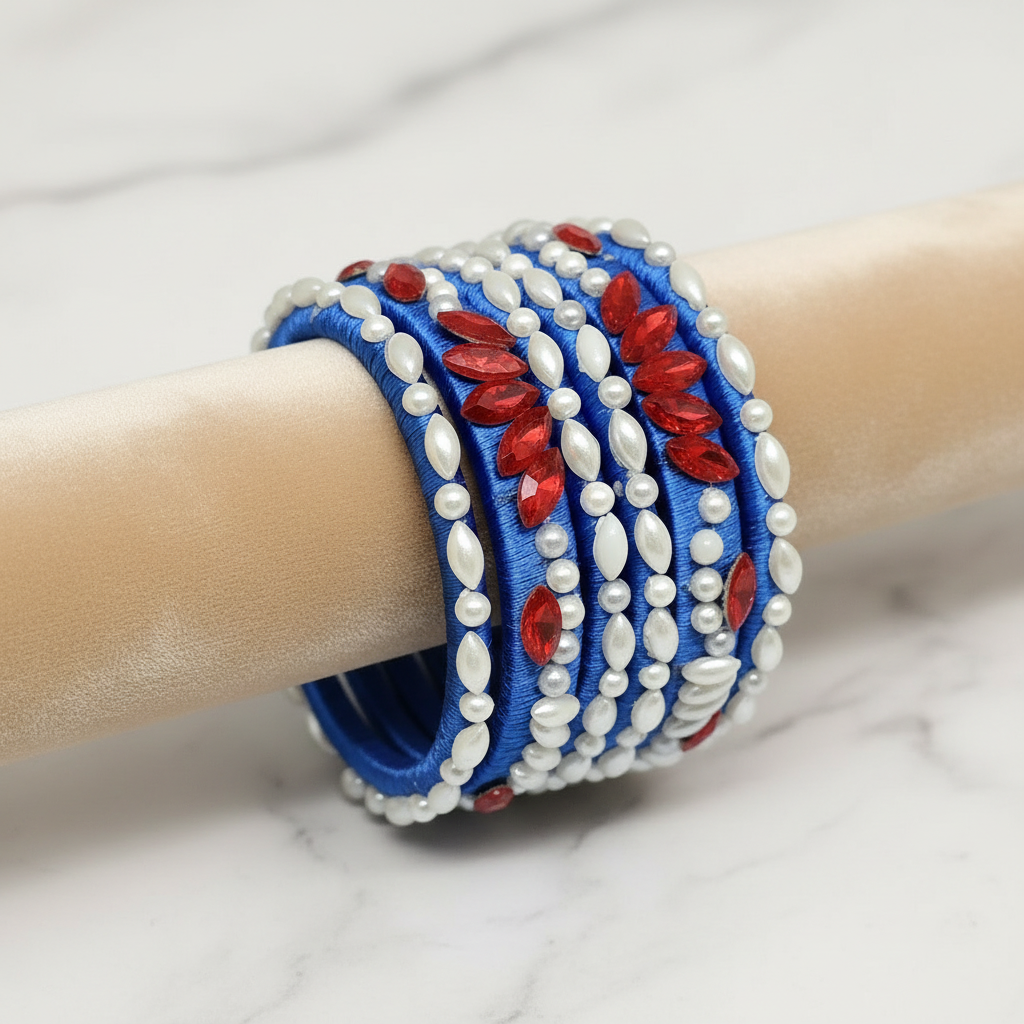 Royal blue Pearl Crystal silk thread bangles with white pearls and red crystals in a floral design.