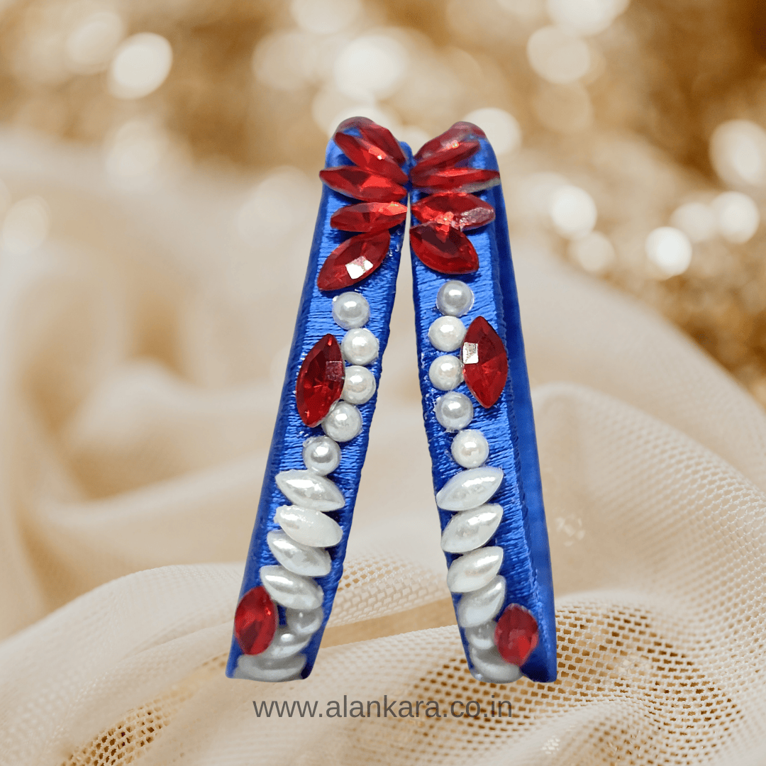 Royal blue floral pearl crystal silk thread bangles showcasing red crystals and white pearls in an elegant design.