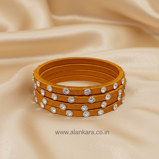 Golden Noori Silk Thread Bangles elegantly handcrafted with rich golden-mustard silk thread and Noori embellishments.
