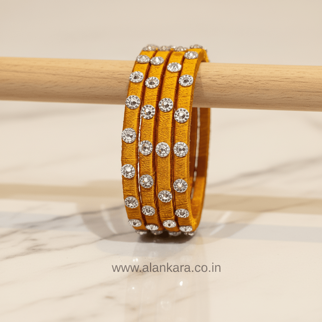 Golden Noori Silk Thread Bangles showcasing rich golden-mustard silk and delicate Noori embellishments.
