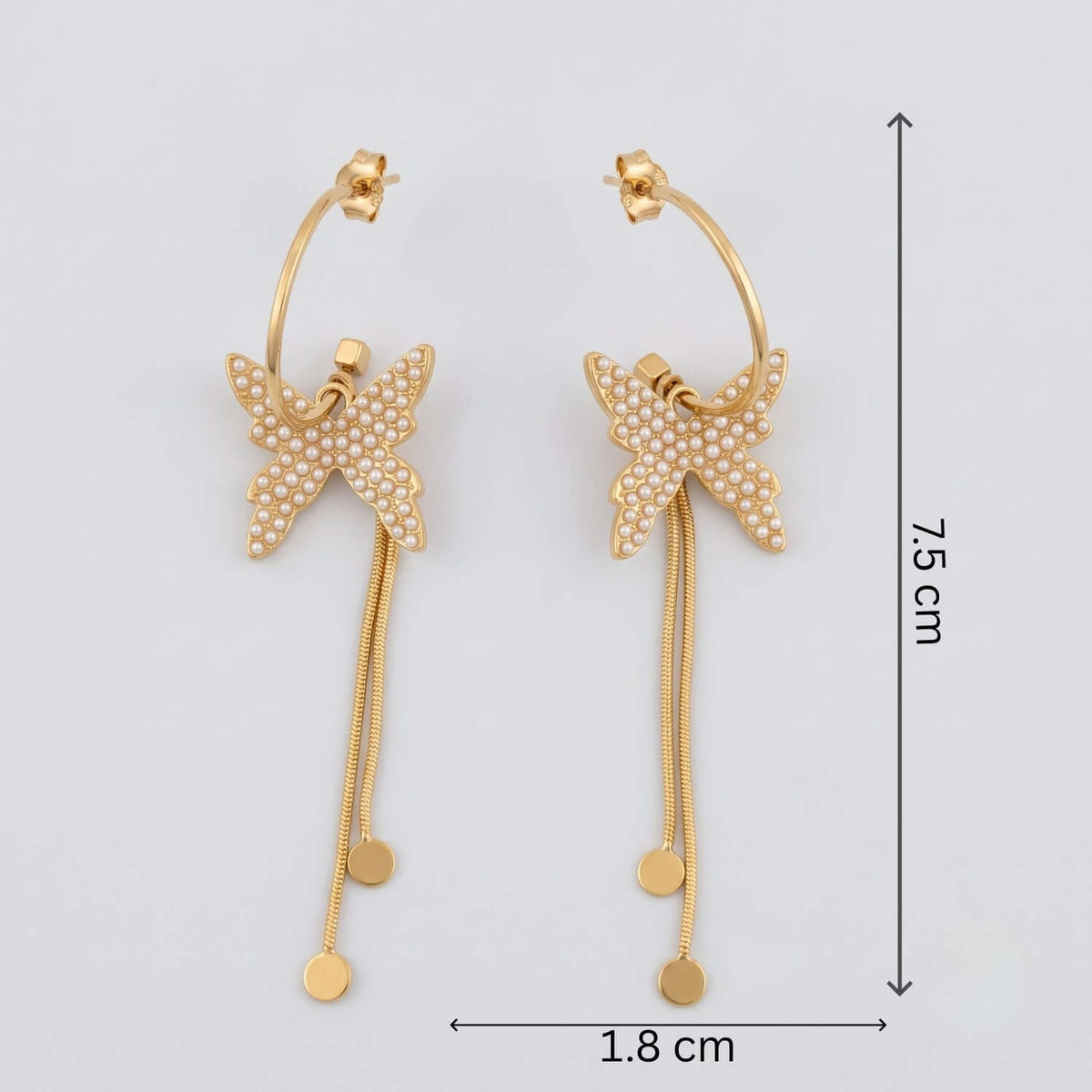 Golden pearl Butterfly dangler earrings with cubic zirconia, gold plated finish, perfect for Indian and western outfits.