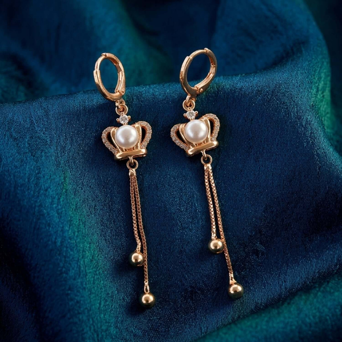 Golden Pearl Heart dangler earrings featuring crown design with pearls and hanging elements.