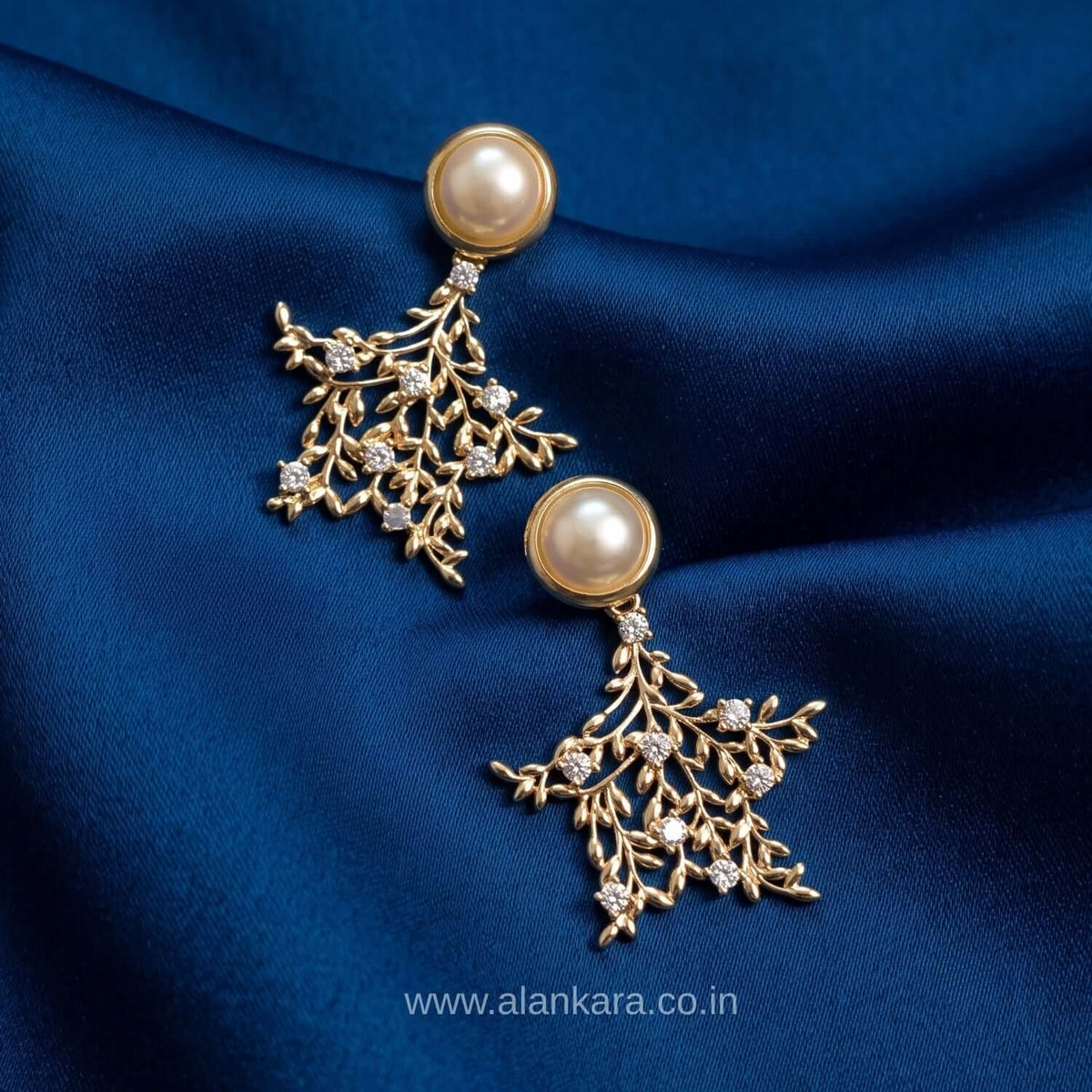 Stylish western earrings - Golden pearl leaf studs | Alankara