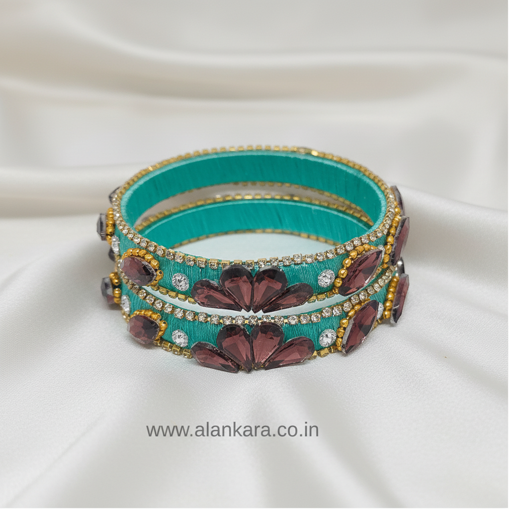 Pista Green Crystal Silk Thread Kada Bangles featuring rich wine-colored crystals and golden detailing.