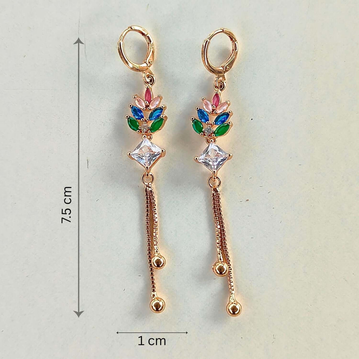 Multicolor Crown Dangler earrings showcasing vibrant crystals and gold plating, perfect for Indian and western outfits.