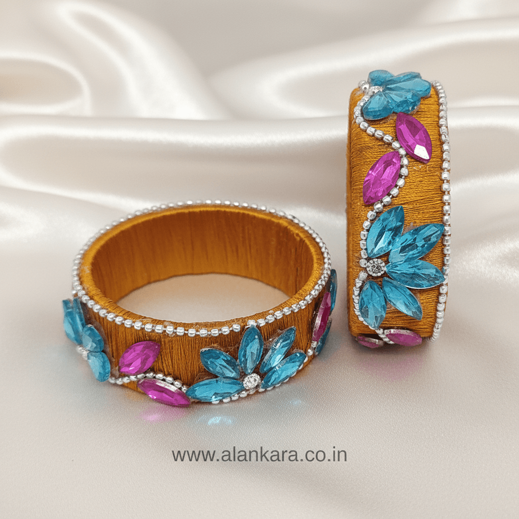 Mustard Floral Crystal Silk Thread Kada Bangles with aqua blue floral stones and pink marquise crystals.