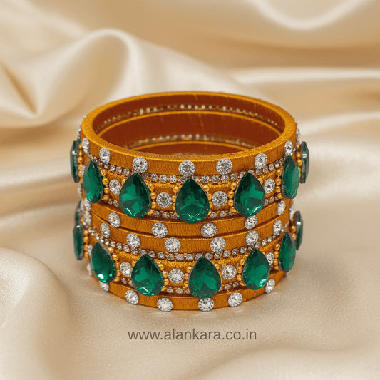 Golden Green Crystal Silk Thread Bangles featuring emerald green crystals and AD stones on silk thread.