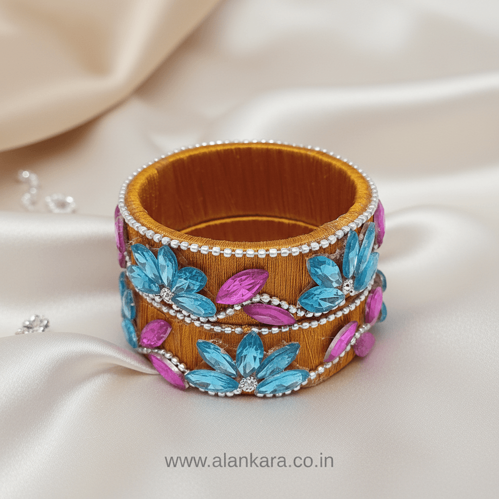 Mustard Floral Crystal Silk Thread Kada Bangles featuring aqua blue and pink crystals on silk thread.