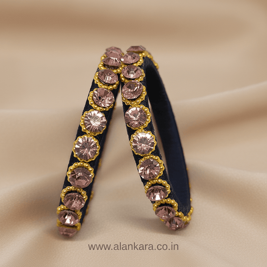 Navy Blue Crystal Silk Thread Kada Bangles adorned with blush-pink crystals and golden beads on a soft background.