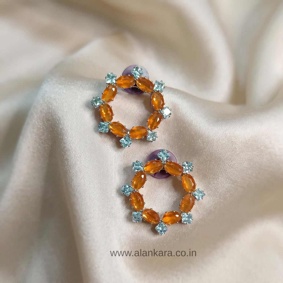 Elegant Orange Crystal Stud earrings featuring cubic zirconia, stylish for Indian and western outfits.