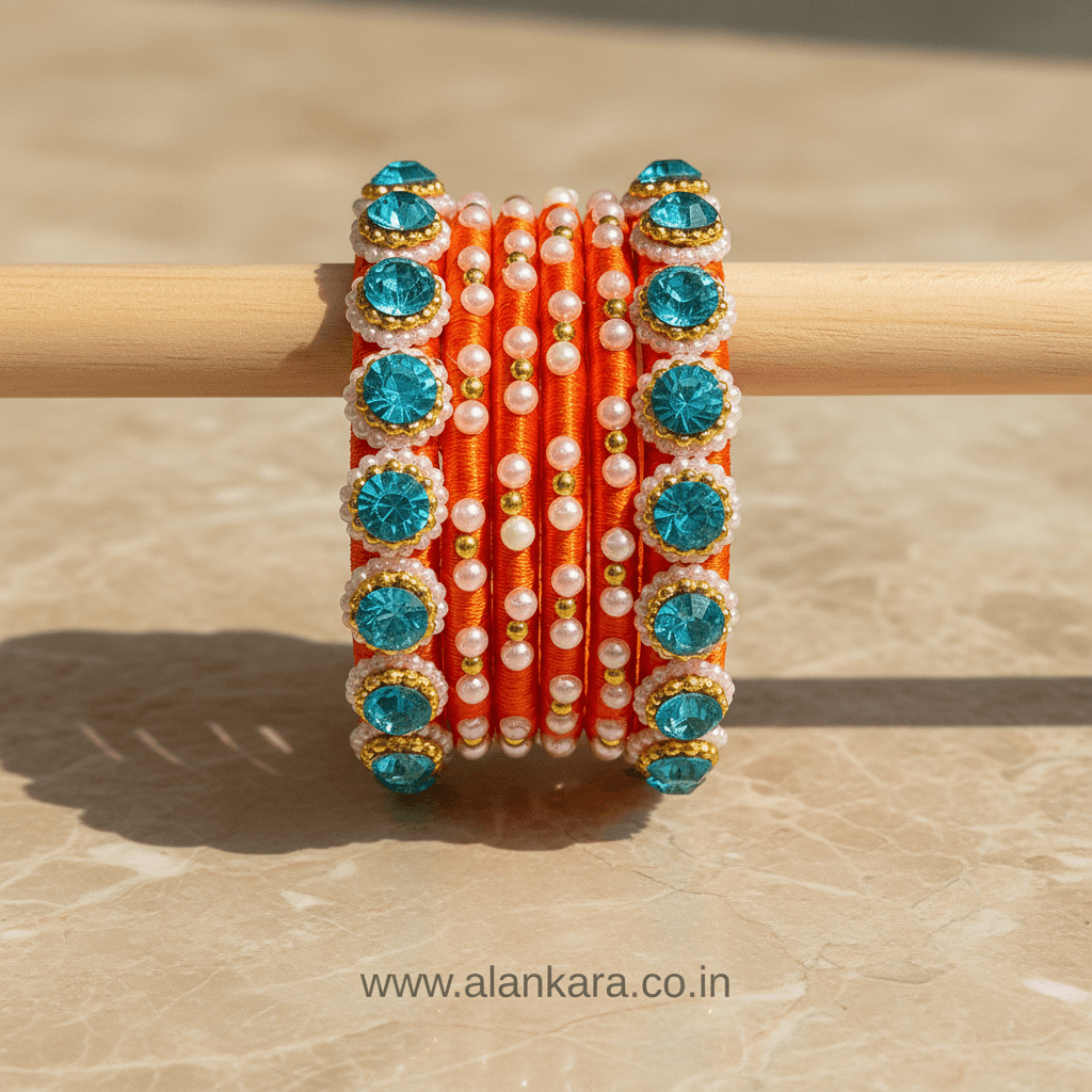 Orange & Blue Pearl Silk Thread Bangles showcasing vibrant colors and beautiful embellishments.