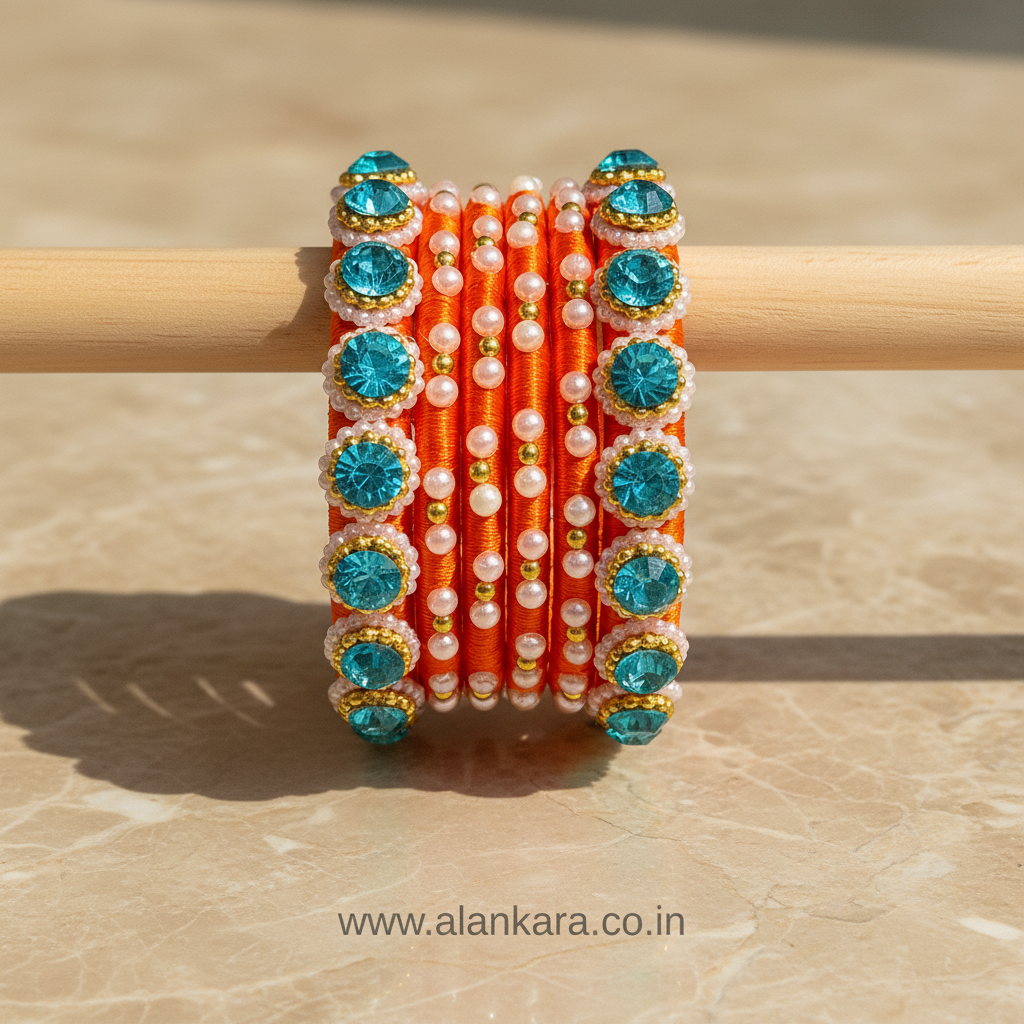 Orange & Blue Pearl Silk Thread Bangles showcasing vibrant colors and beautiful embellishments.