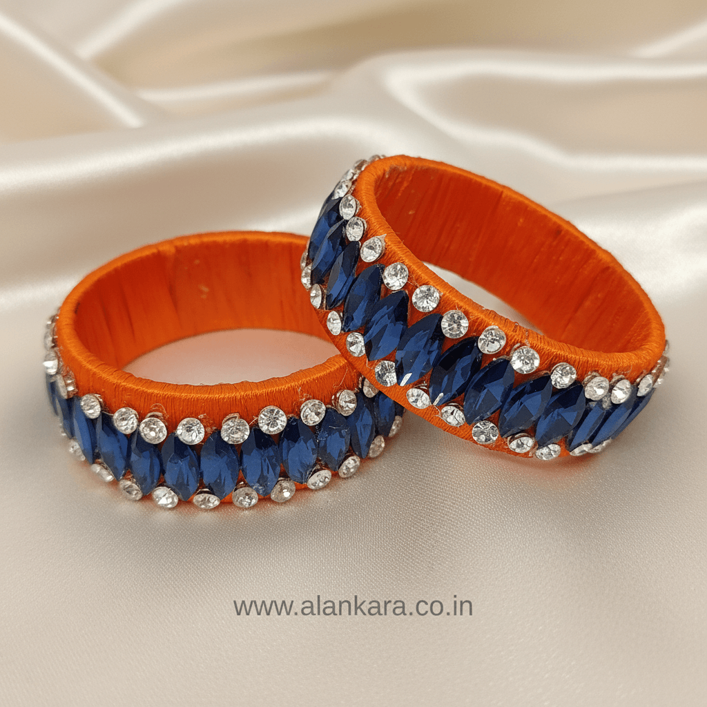 Orange Blue Crystal Silk Thread Kada Bangles featuring deep blue crystals and sparkling zircon stones on orange silk.