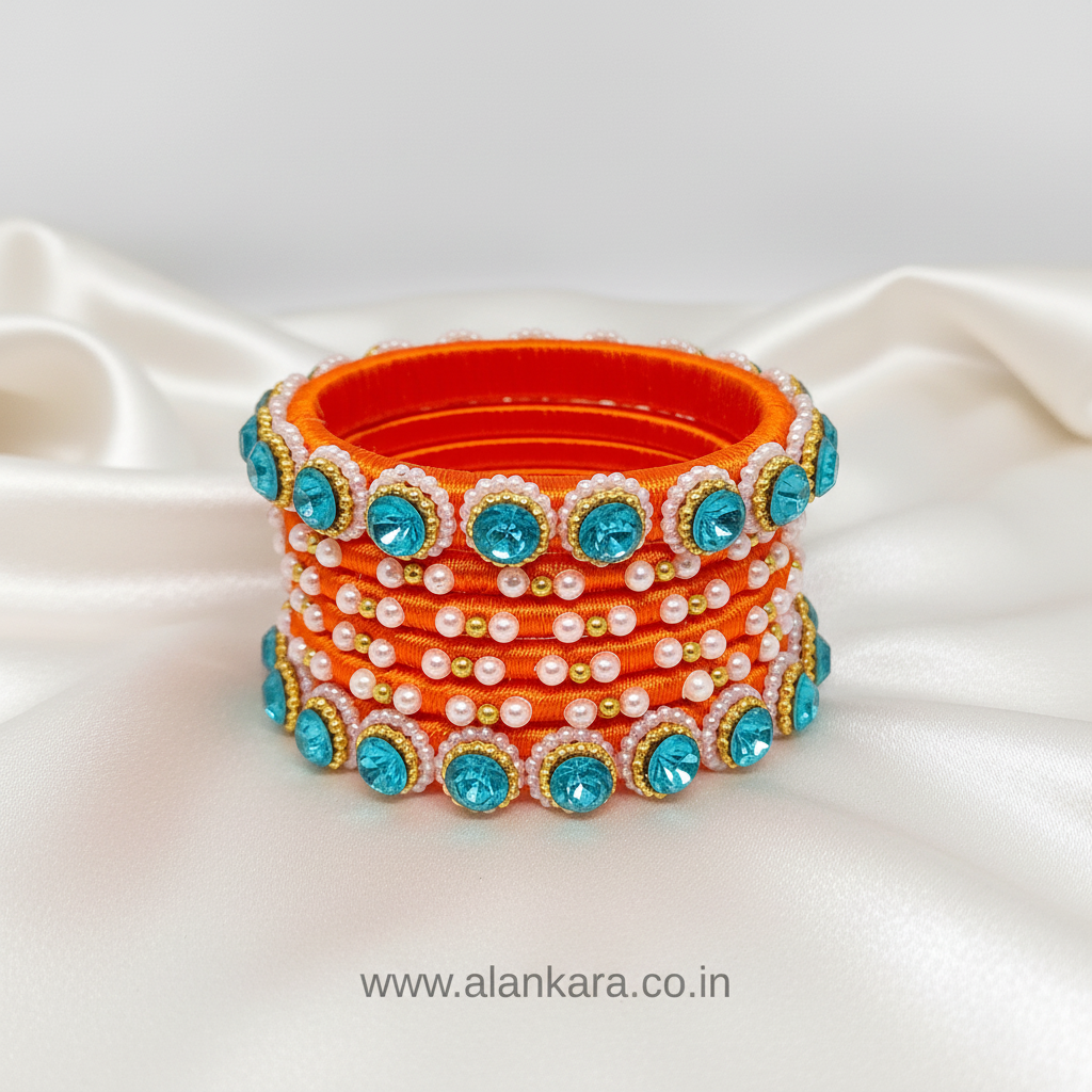 Orange & Blue Pearl Silk Thread Bangles showcasing orange silk thread with blue crystals and white pearls.