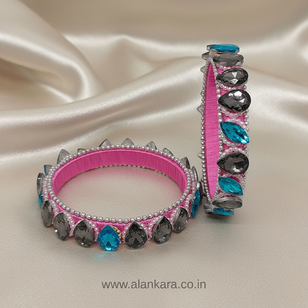 Pink Crystal Silk Thread Kada Bangles with pink silk thread, grey and blue crystals, and silver beads on a silk background.