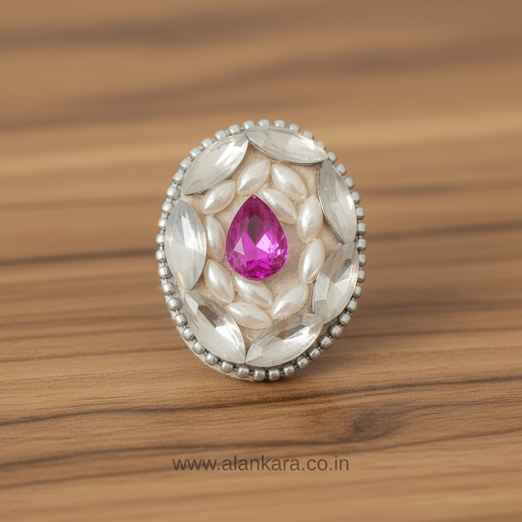 Royal Pink Crystal and Pearl Saree Pin featuring pink and white stones on a decorative brooch